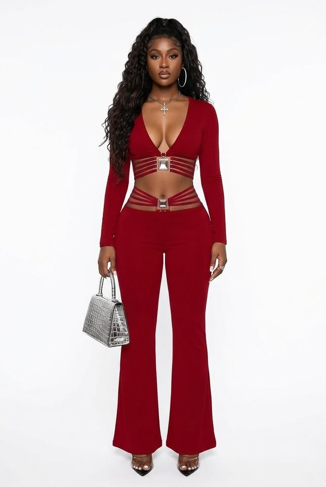 Red high-waist flared pants with tummy-control and butt-lifting features, paired with a deep V-neck crop top and silver handbag.