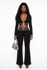 Black high-waist flared pants featuring tummy-control and butt-lifting design, paired with a fitted black top and handbag.